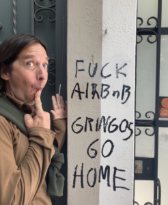 Anti-Airbnb message on a wall in CDMX.