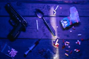 violent crime in Mexico depicted by guns and drugs.