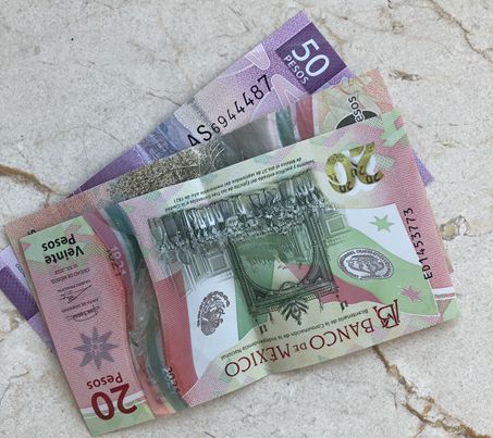 Mexican pesos on a table