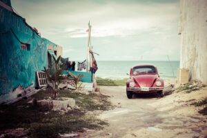 an old Volkswagen at the beach in Mexico
